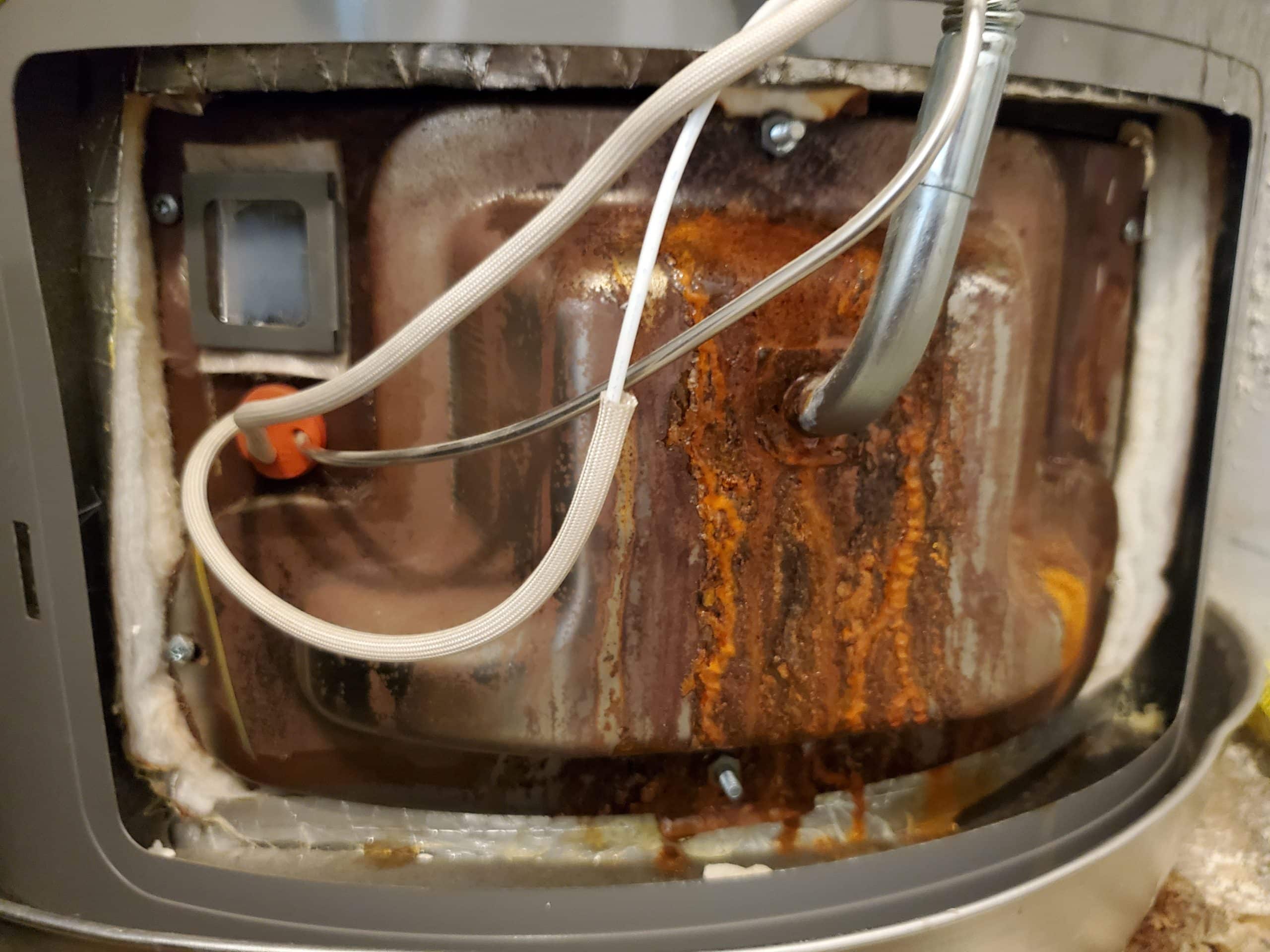 Rusty water heater parts.